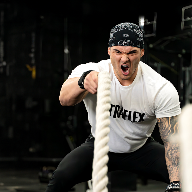 Jeremy Buendia working out with ropes in a gym